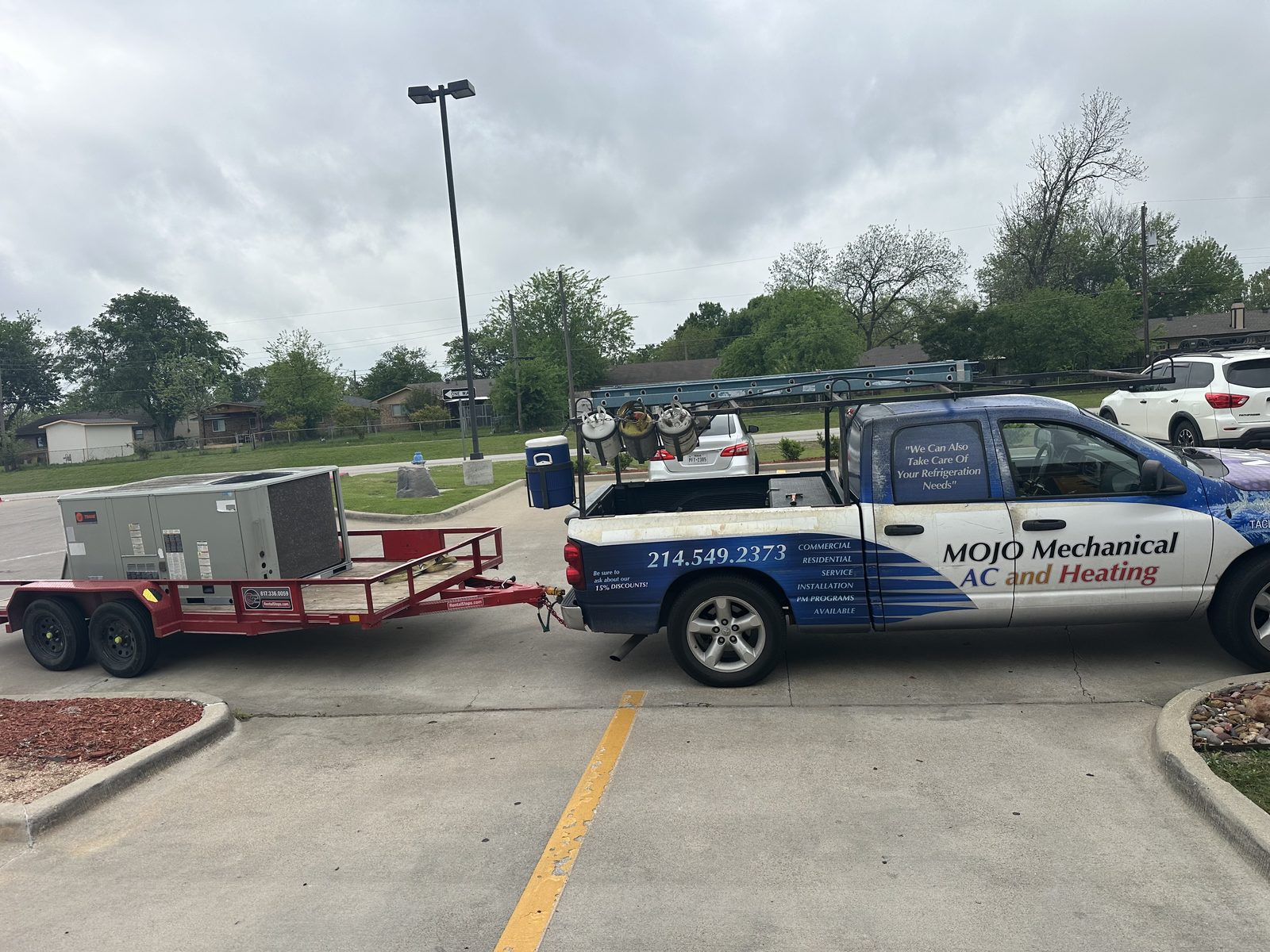Mojo Mechanical service truck delivering new Trane commercial HVAC equipment